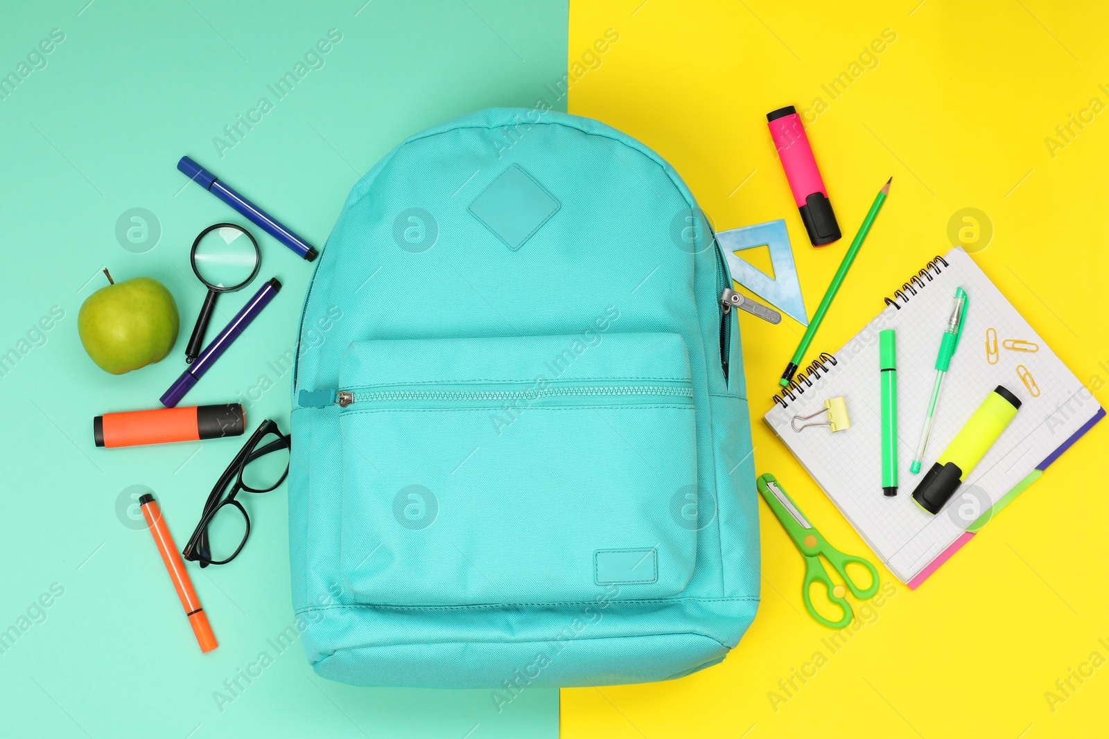 Photo of Flat lay composition with backpack and different school stationery on color background