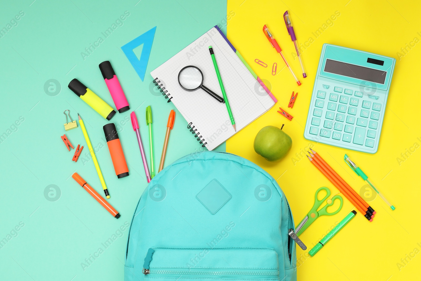 Photo of Flat lay composition with backpack and different school stationery on color background