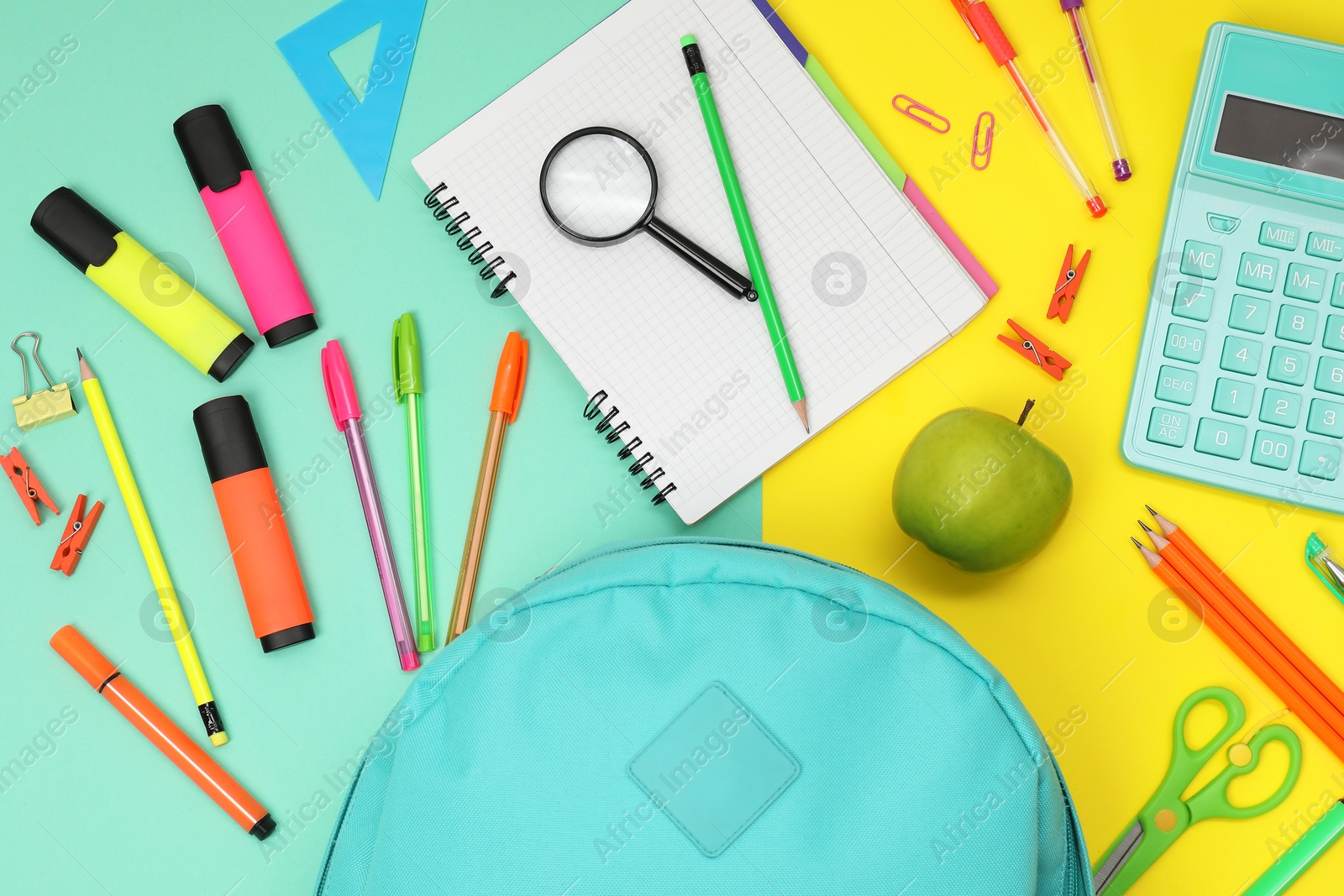 Photo of Flat lay composition with backpack and different school stationery on color background