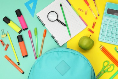 Photo of Flat lay composition with backpack and different school stationery on color background