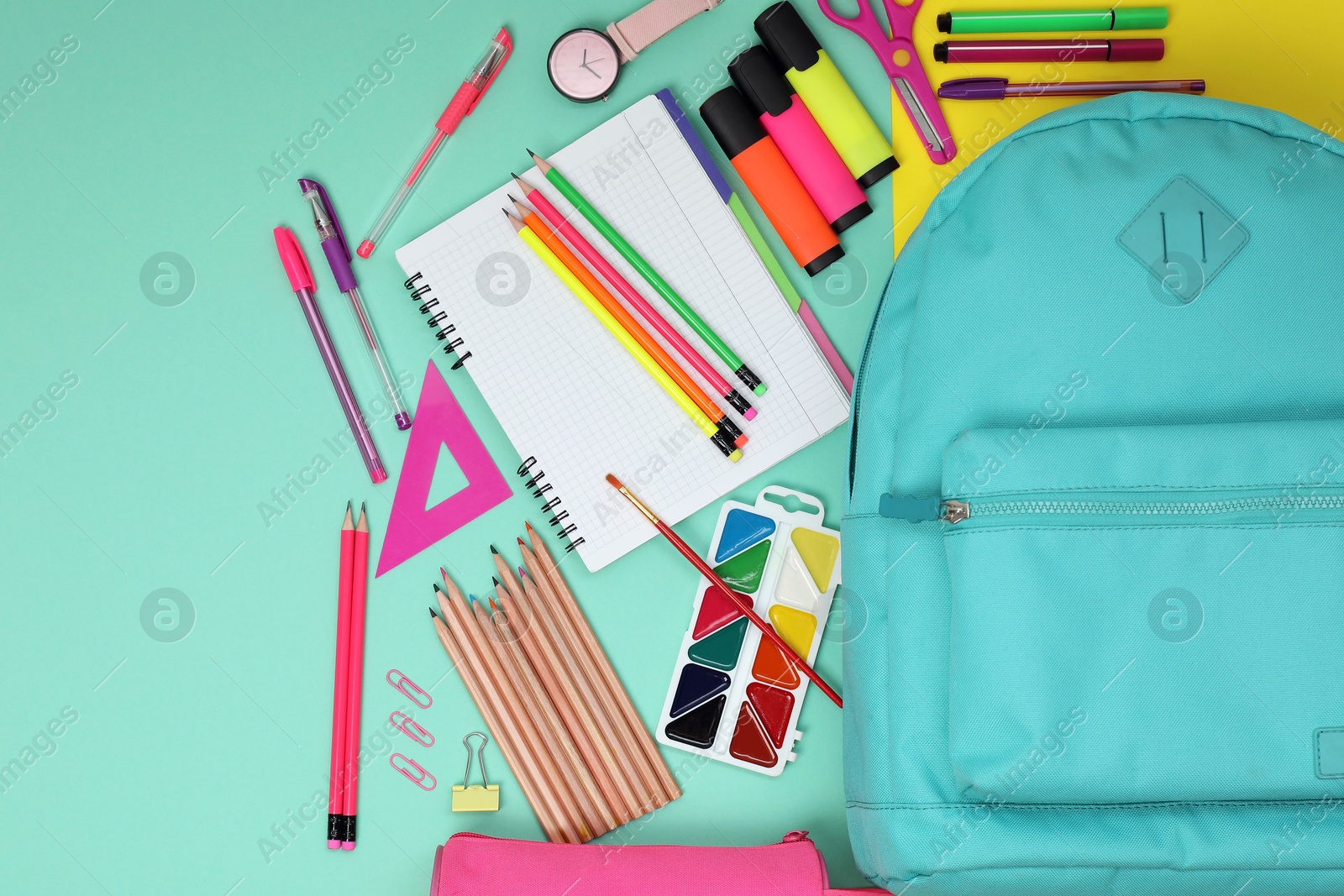 Photo of Flat lay composition with backpack and different school stationery on color background