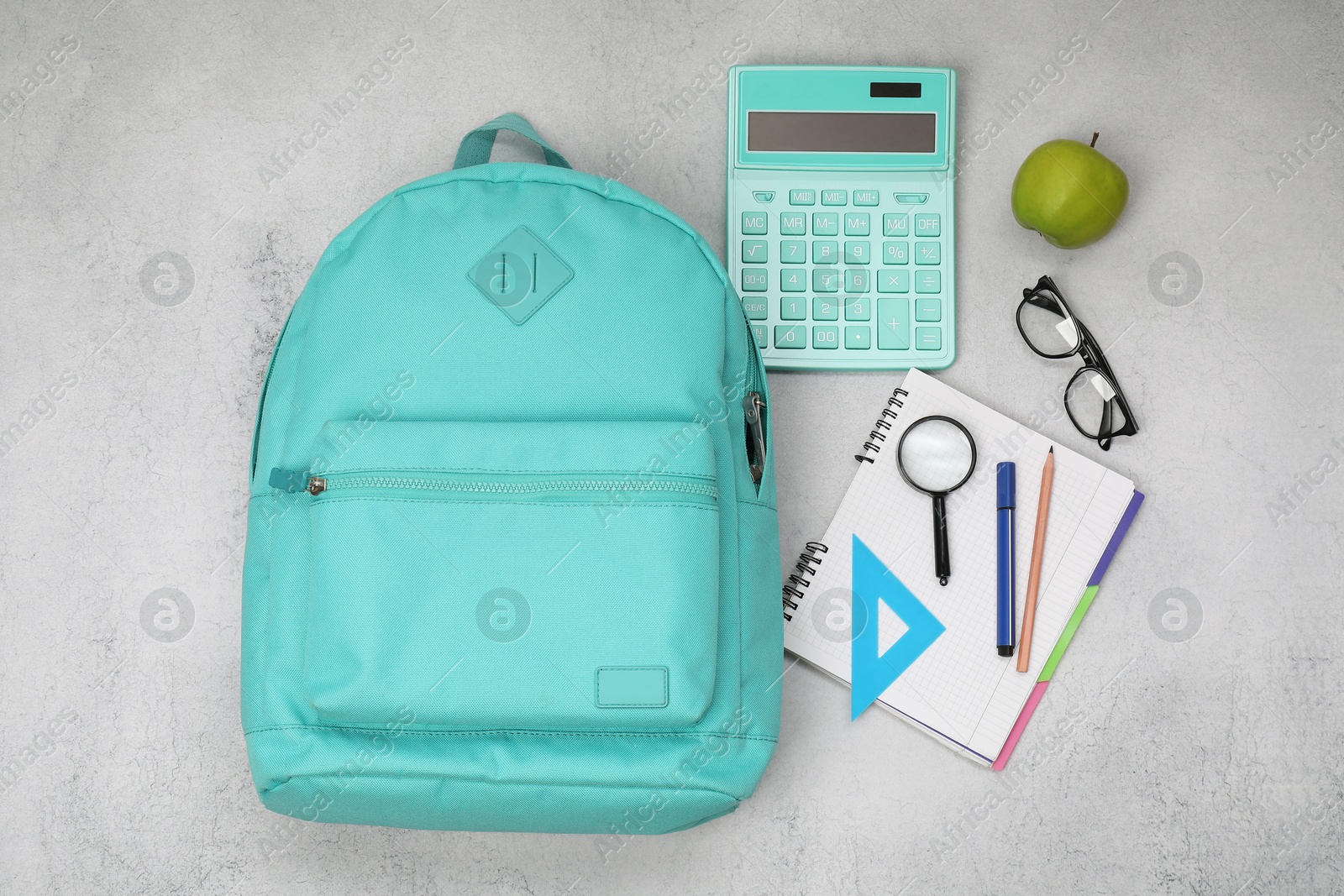 Photo of Flat lay composition with backpack and different school stationery on light grey table