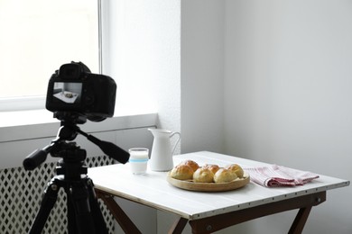 Photo of Shooting food with professional camera in photo studio