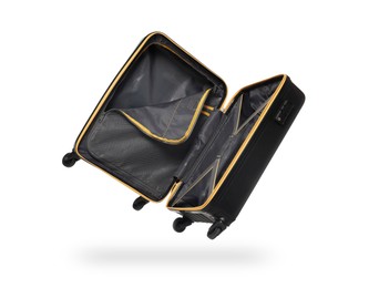 Image of Open empty suitcase in air on white background