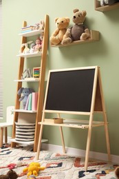 Photo of Stylish child room interior with different toys and furniture