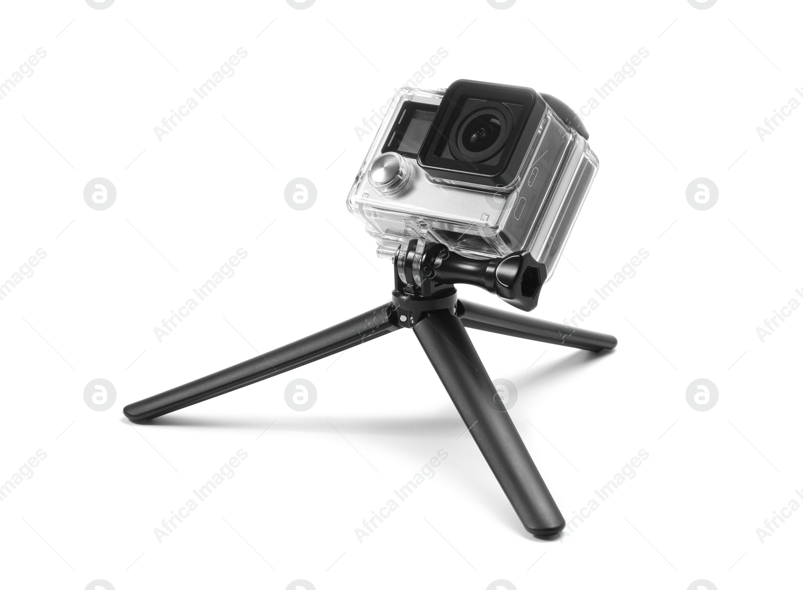 Photo of Modern action camera and tripod isolated on white