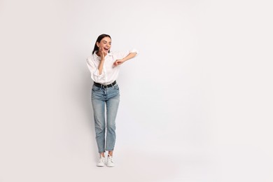 Photo of Happy woman on white background. Space for text