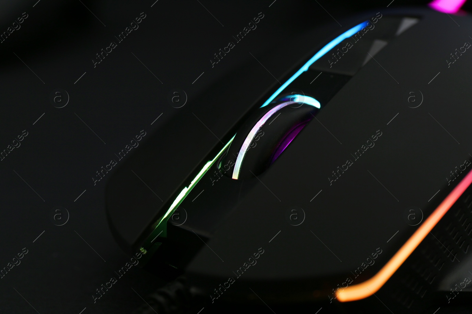 Photo of Computer mouse on black background, closeup view