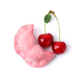 Frozen dumpling (varenyk) and fresh cherries isolated on white. Ukrainian cuisine