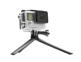 Photo of Modern action camera and tripod isolated on white