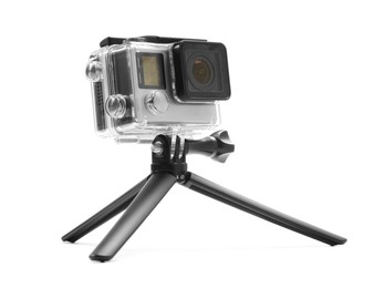 Photo of Modern action camera and tripod isolated on white