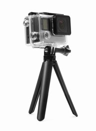 Photo of Modern action camera and tripod on white background