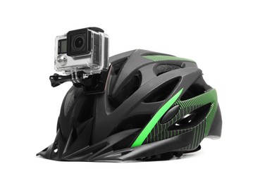 Photo of Modern action camera on helmet against white background