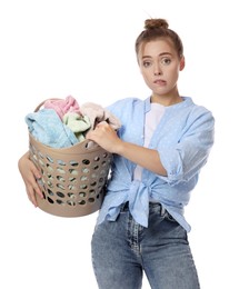 Photo of Tired housewife with basket full of laundry on white background