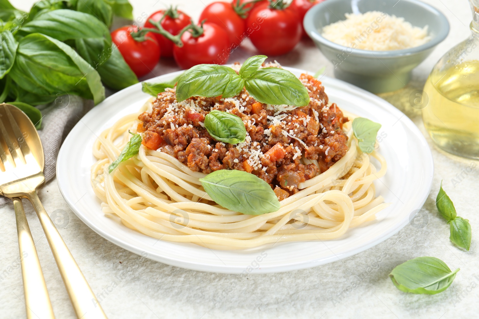 Photo of Tasty pasta bolognese served on white table, closeup