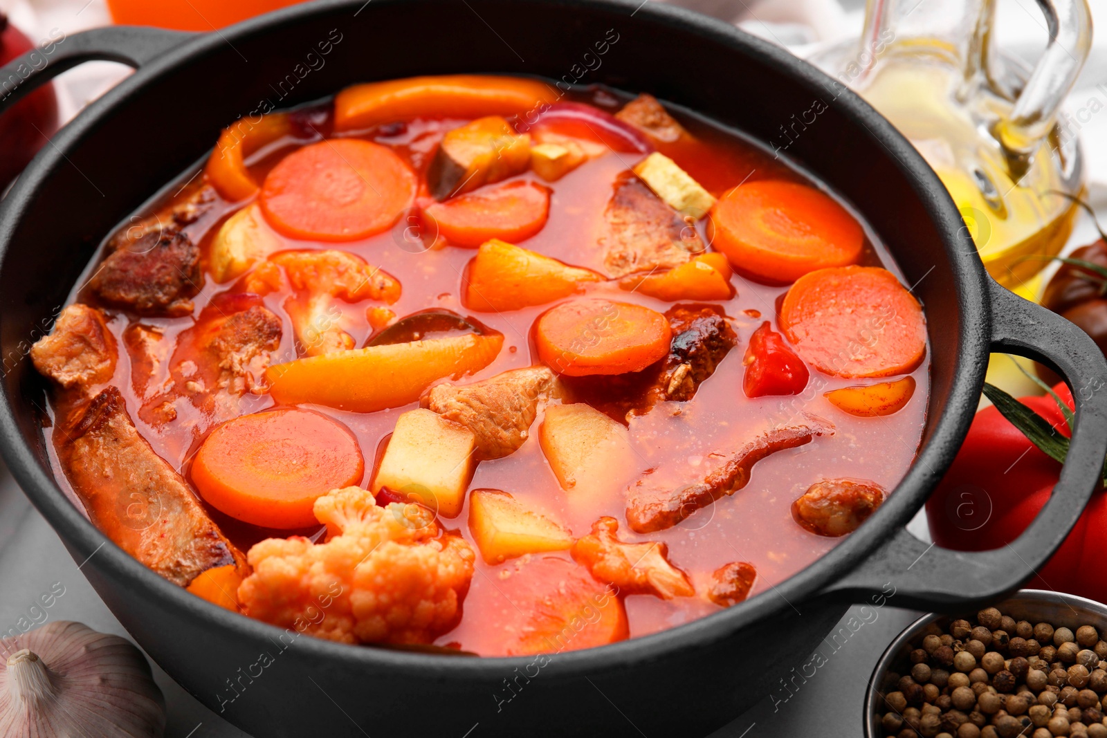 Photo of Tasty homemade stew with vegetables on table, closeup