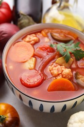 Photo of Tasty homemade stew with vegetables on white table, closeup