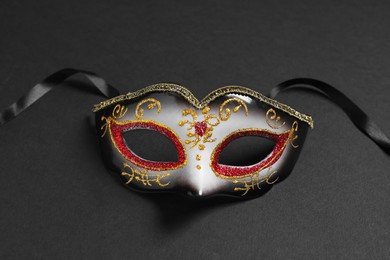 Photo of One beautiful carnival mask on black background