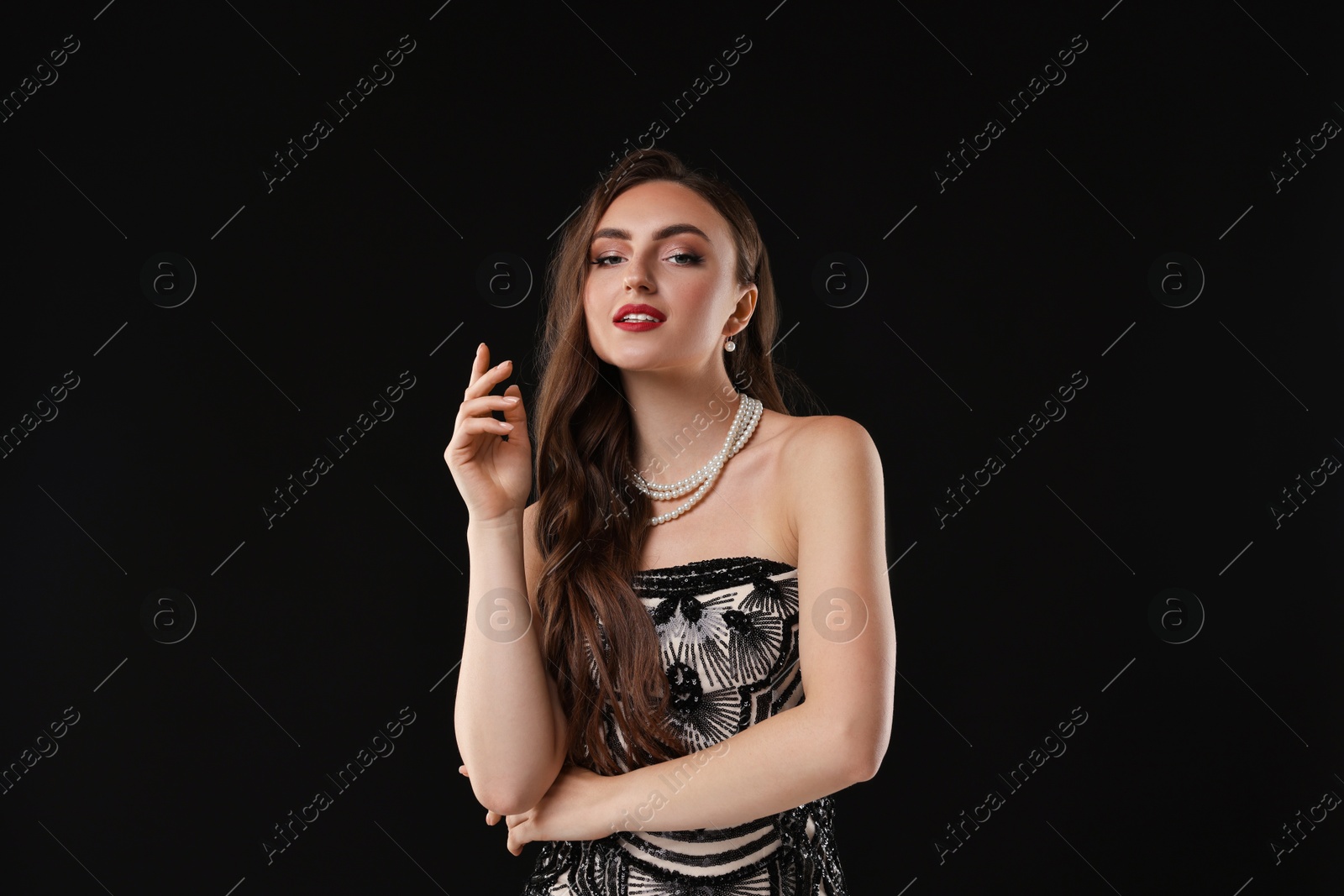 Photo of Portrait of beautiful woman on black background