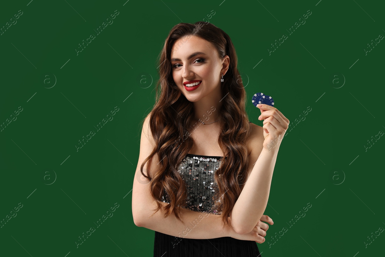 Photo of Smiling woman with poker chips on green background