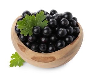 Fresh ripe black currant berries with leaves isolated on white