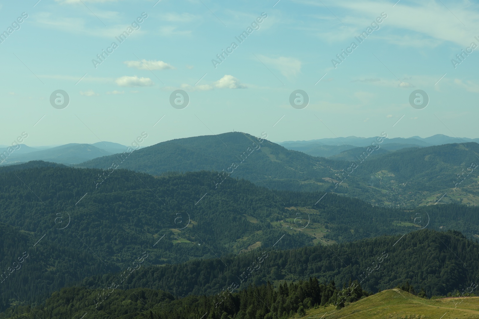 Photo of Picturesque view of mountains with trees under sky