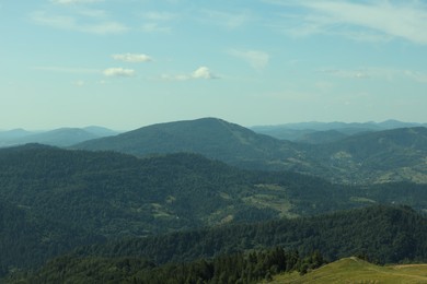 Photo of Picturesque view of mountains with trees under sky