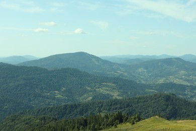 Photo of Picturesque view of mountains with trees under sky