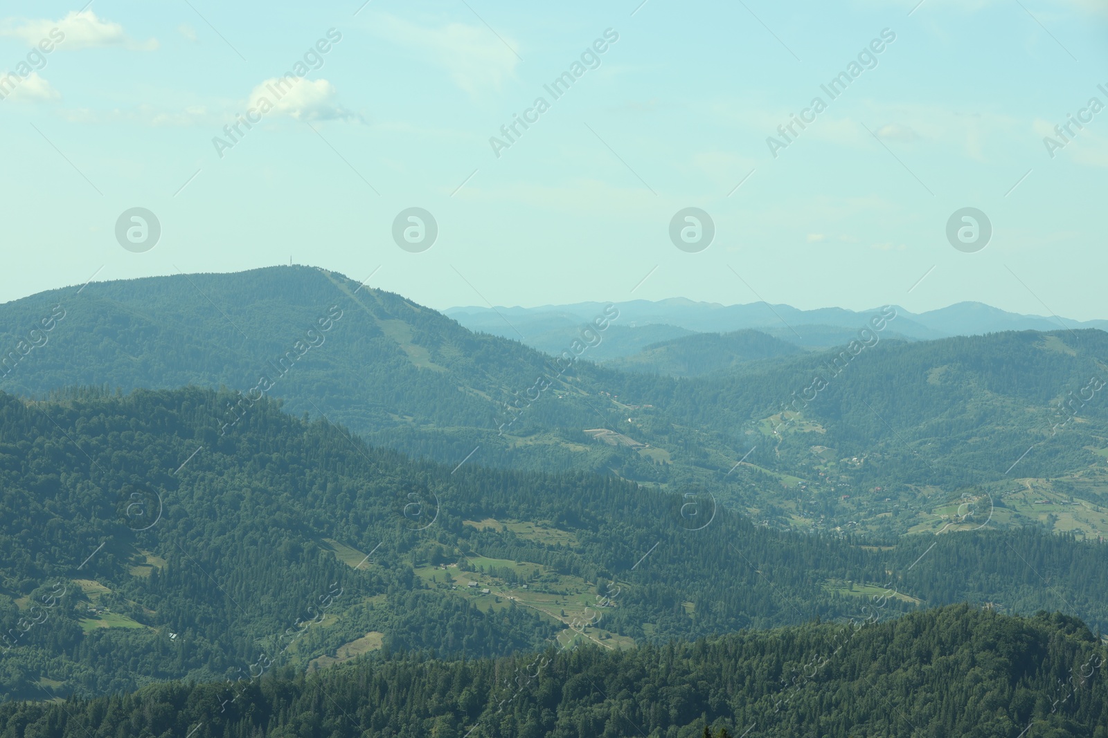 Photo of Picturesque view of mountains with trees under sky