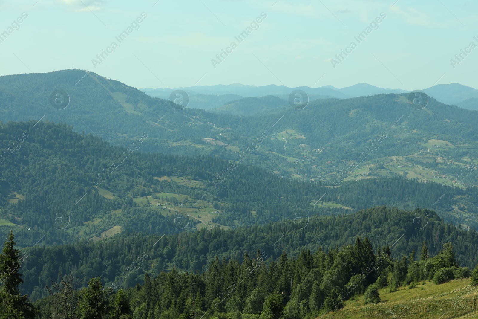 Photo of Picturesque view of mountains with trees under sky