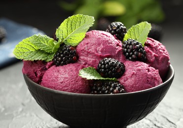 Delicious blackberry sorbet, fresh berries and mint in bowl on gray table, closeup