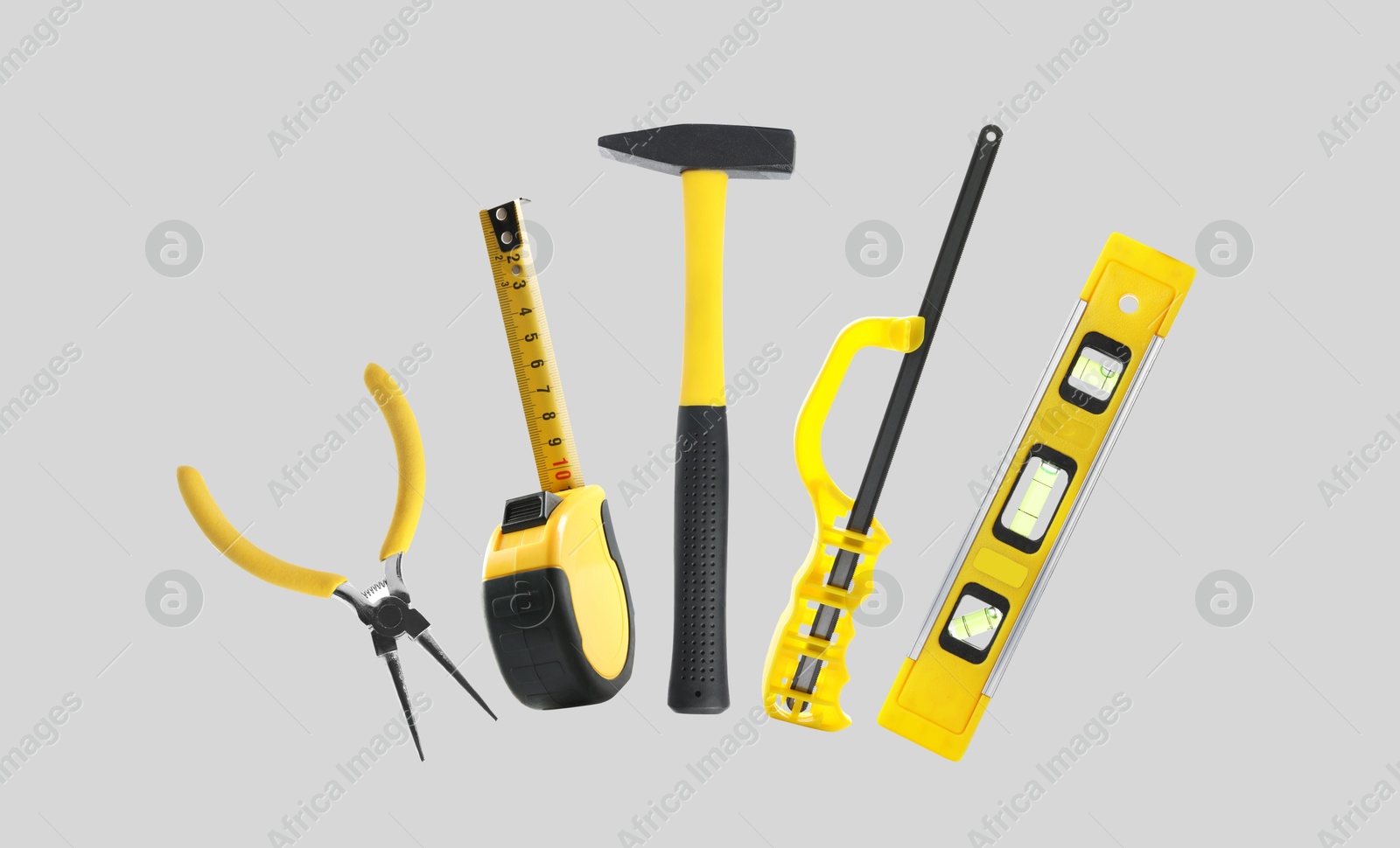 Image of Set of different construction tools on light grey background