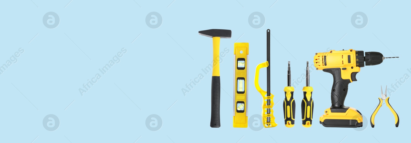 Image of Set of different construction tools on light blue background, space for text. Banner design