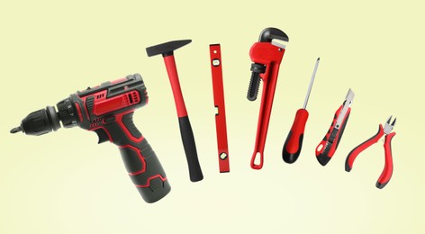 Image of Set of different construction tools on light background