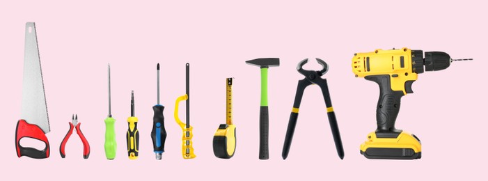 Image of Set of different construction tools on pale pink background. Banner design