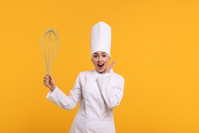 Image of Emotional pastry chef with big whisk on orange background