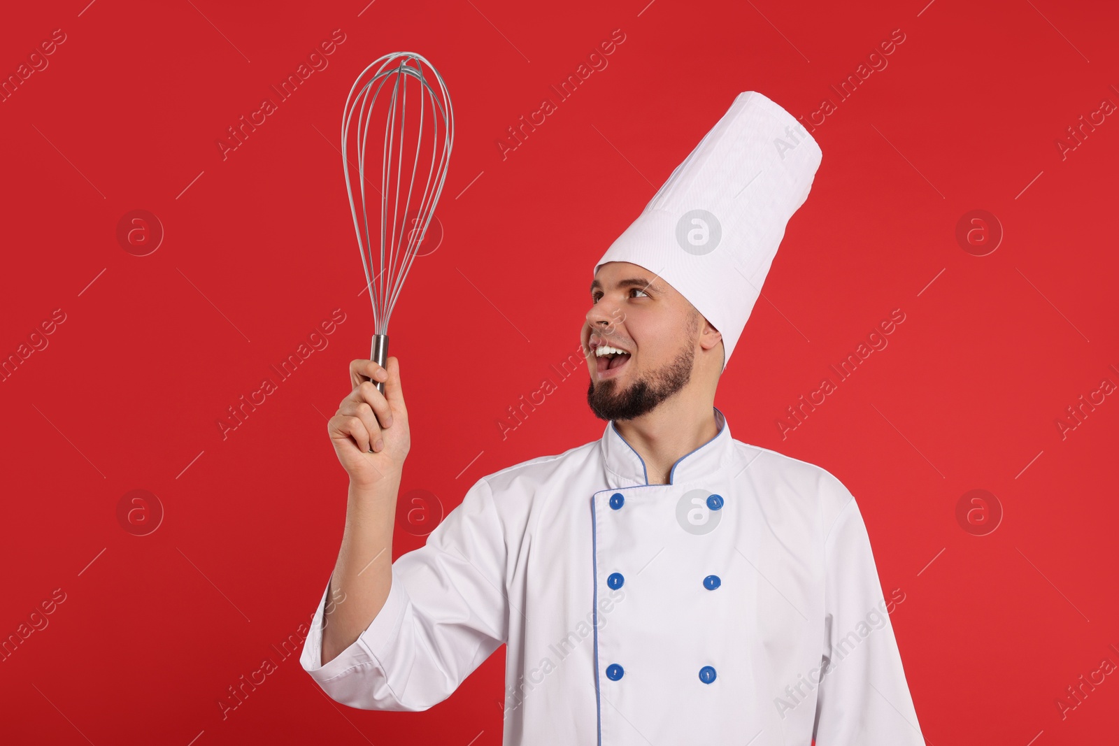 Image of Pastry chef with big whisk on red background