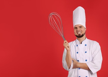 Happy pastry chef with big whisk on red background. Space for text