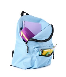 Photo of Backpack with different school stationery isolated on white