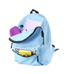 Photo of Backpack with different school stationery isolated on white