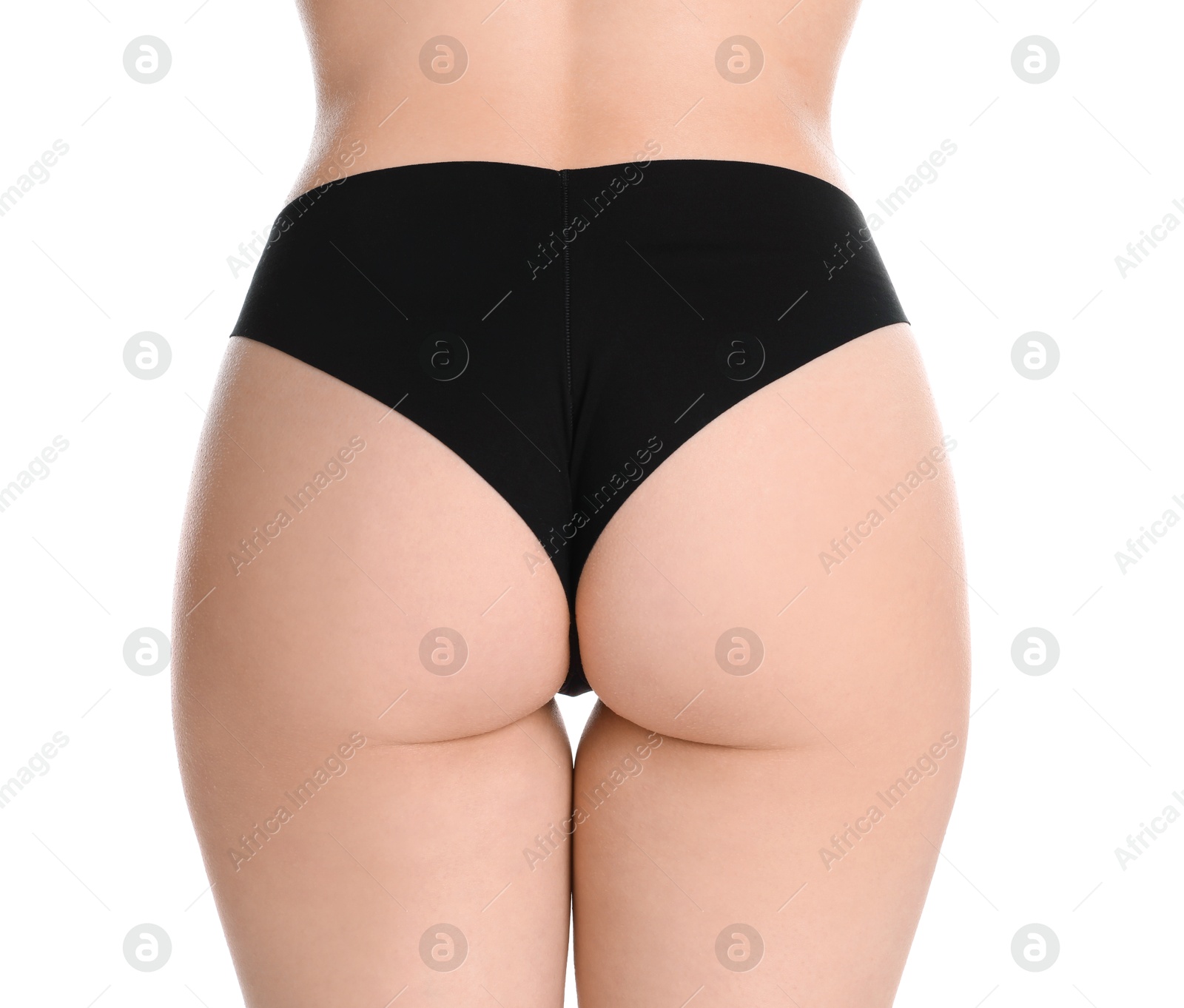 Photo of Woman in black panties showing her slim body on white background, closeup