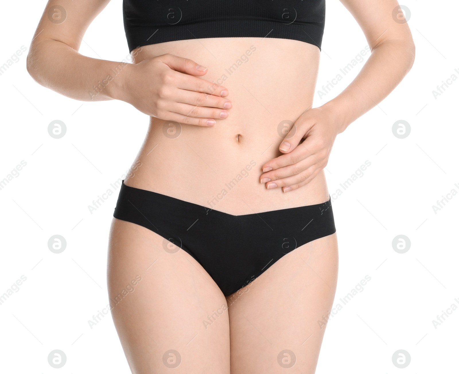 Photo of Woman with slim body posing on white background, closeup