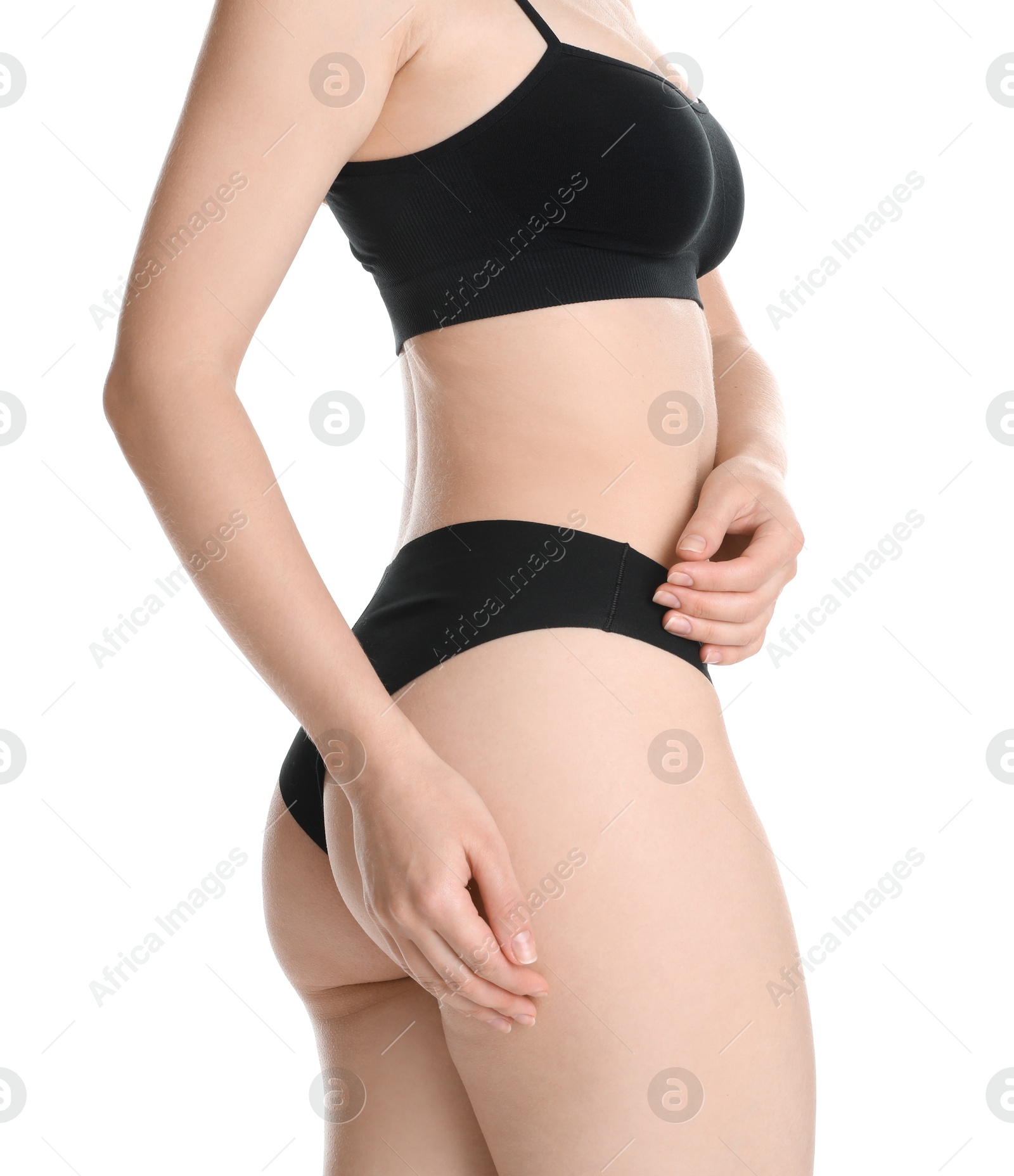 Photo of Woman with slim body posing on white background, closeup