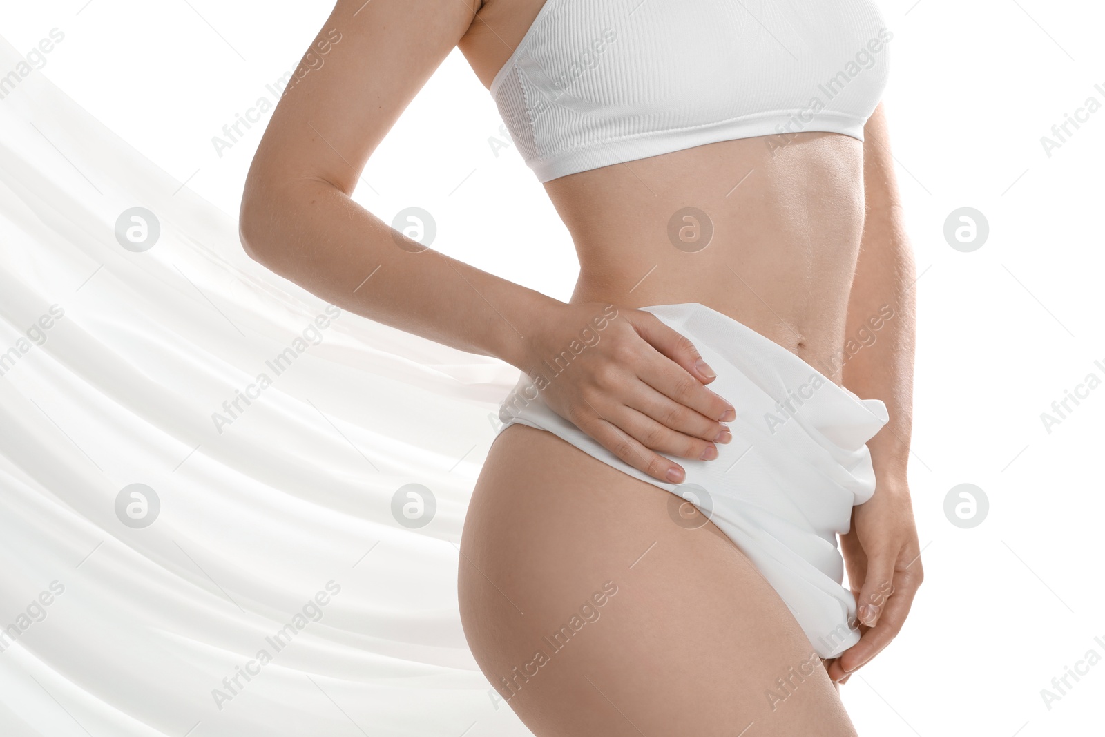 Photo of Woman covering her slim body with silk fabric against white background, closeup