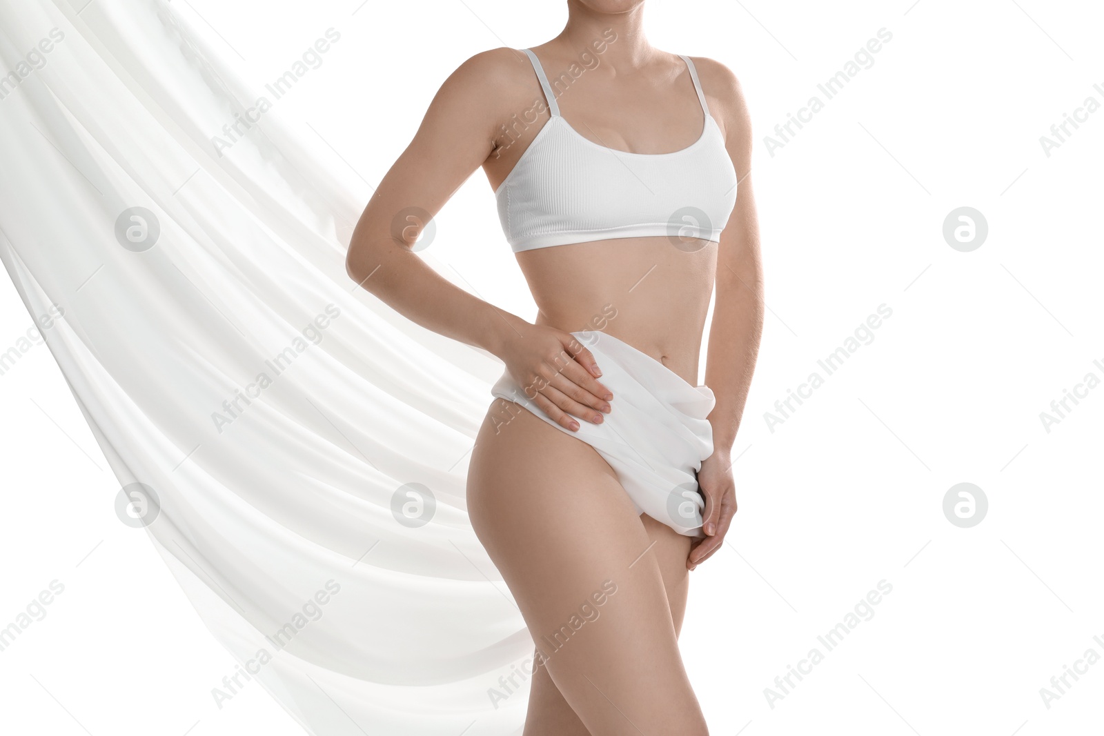 Photo of Woman covering her slim body with silk fabric against white background, closeup