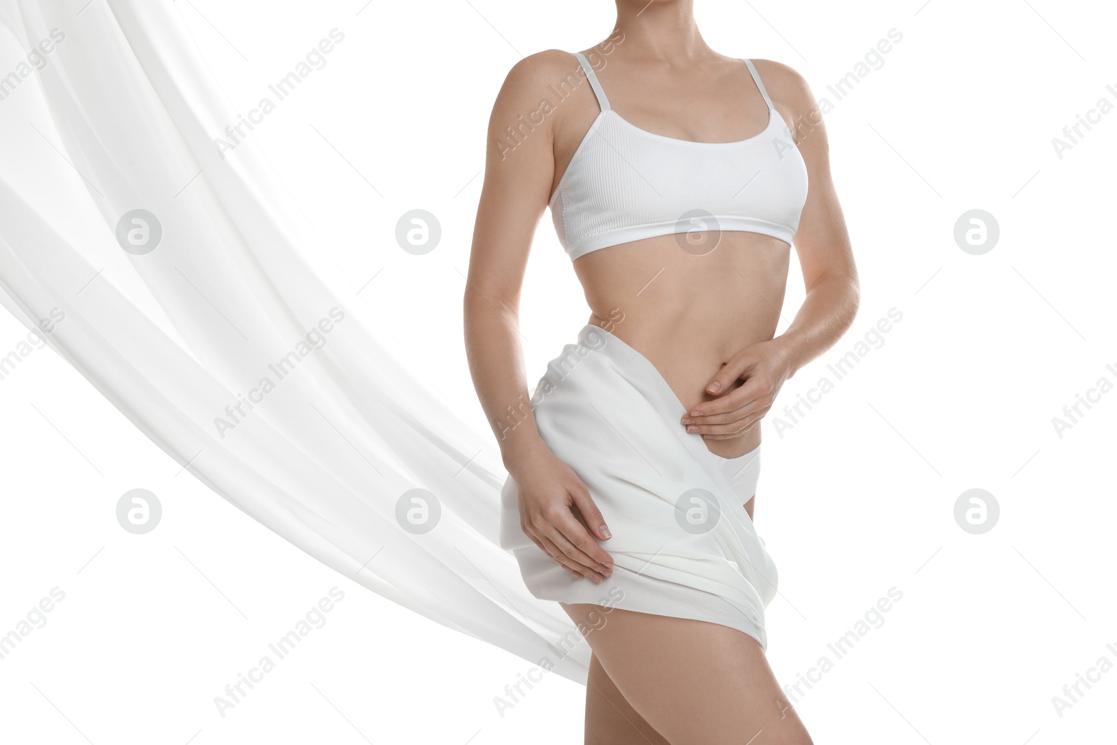 Photo of Woman covering her slim body with silk fabric against white background, closeup