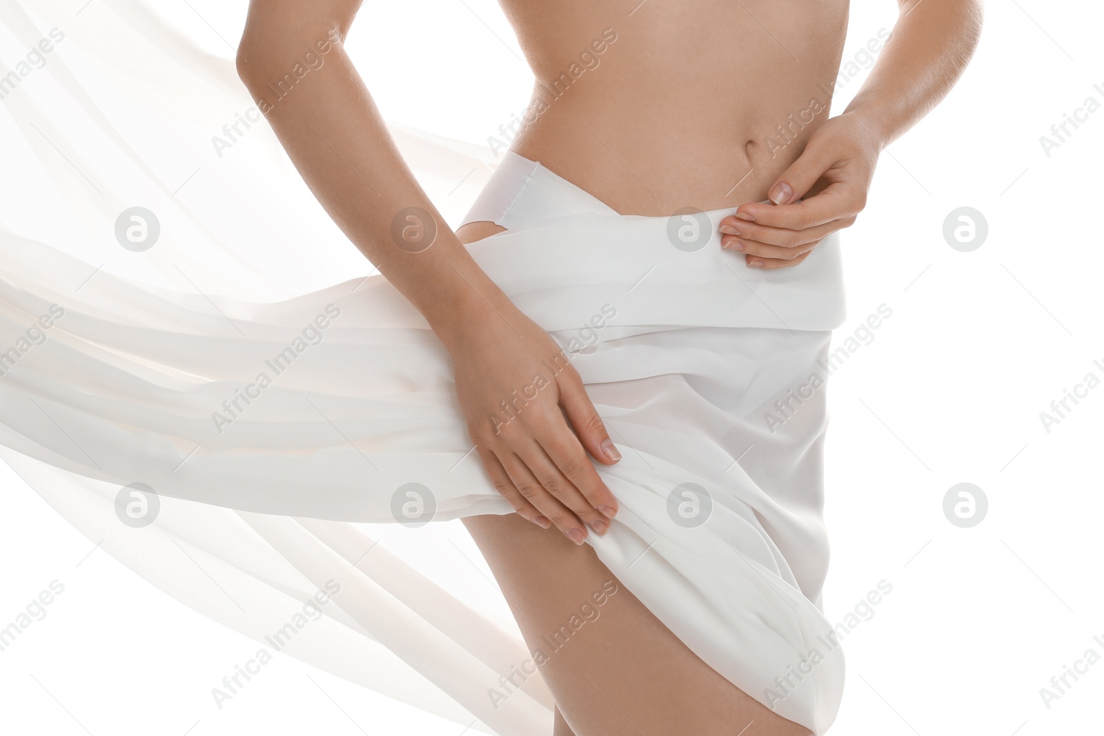 Photo of Woman covering her slim body with silk fabric against white background, closeup