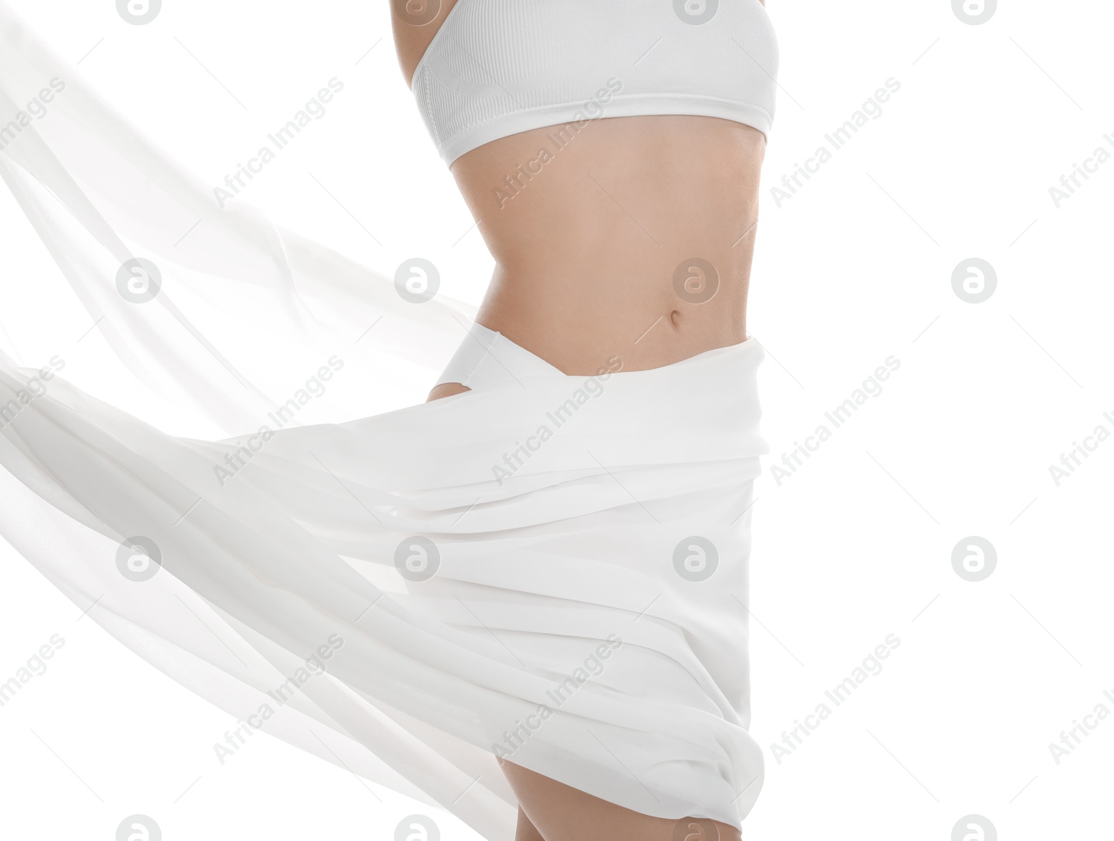 Photo of Woman covering her slim body with silk fabric against white background, closeup