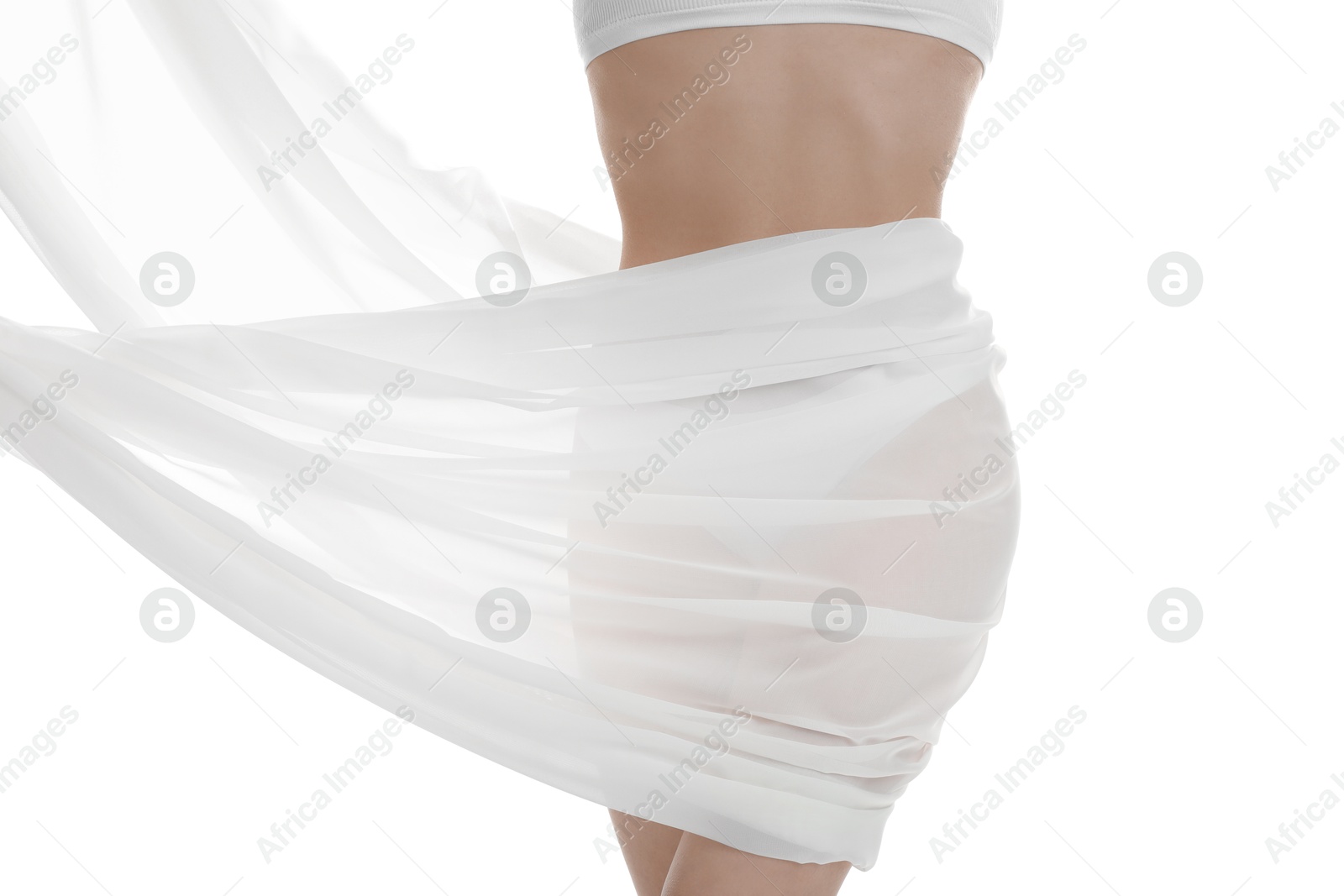 Photo of Woman covering her slim body with silk fabric against white background, closeup