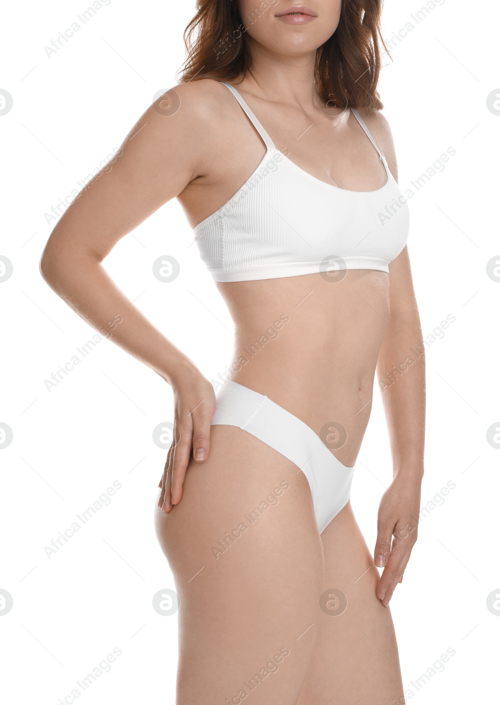 Photo of Woman with slim body posing on white background, closeup